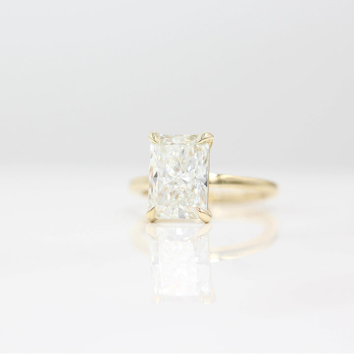  The Celeste Ring (Radiant) in Yellow Gold with 3.75ct Lab-Grown Diamond against a white background