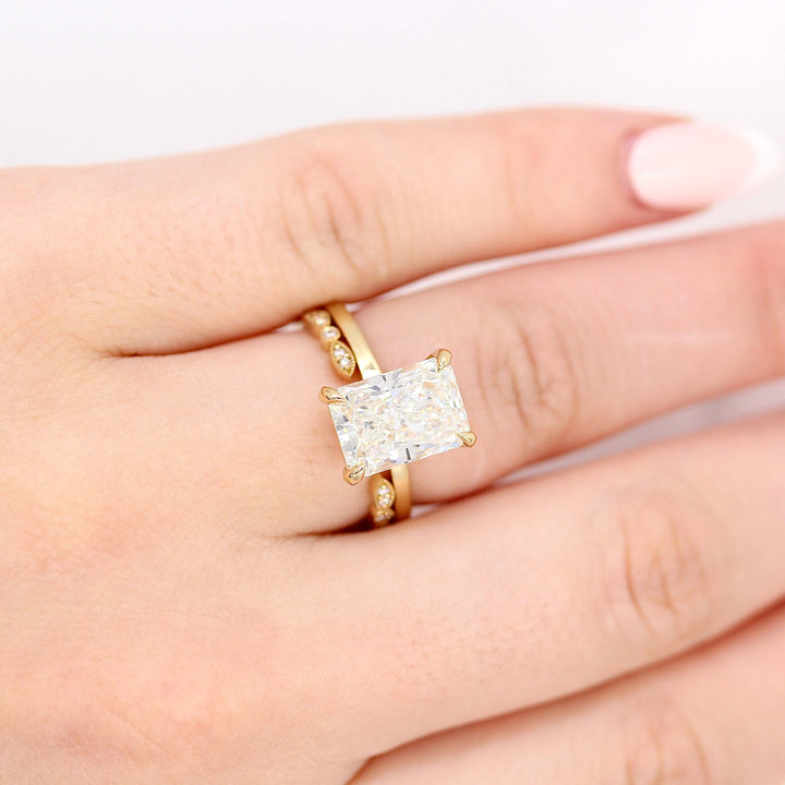  The Celeste Ring (Radiant) in Yellow Gold with 3.75ct Lab-Grown Diamond stacked with the Open Charlotte Wedding Band in Yellow Gold modeled