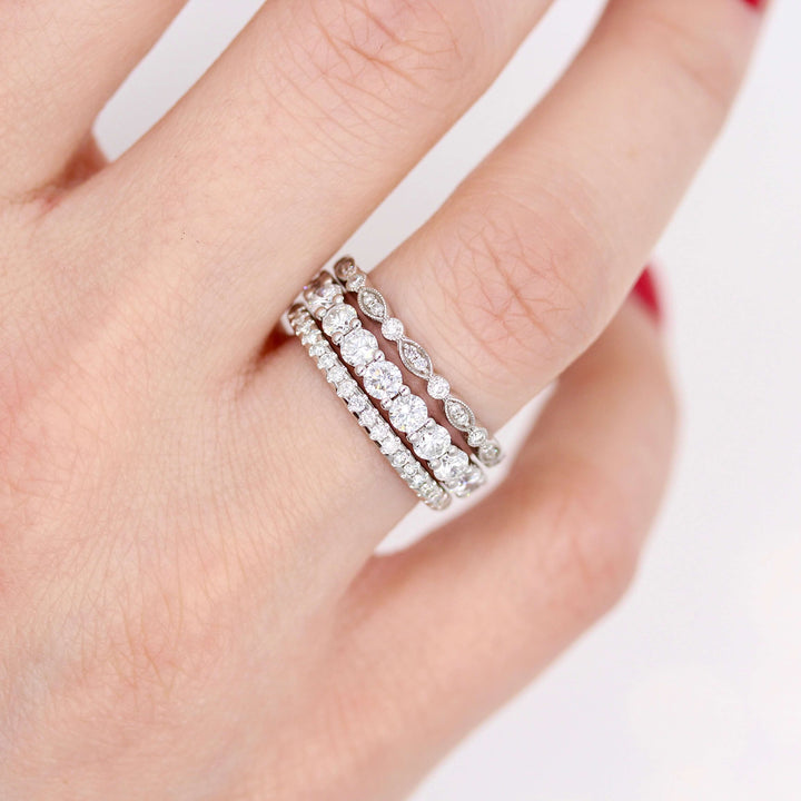 The Charlotte band in white gold stacked with the Lexington and Lauryn bands in white gold modeled on a hand