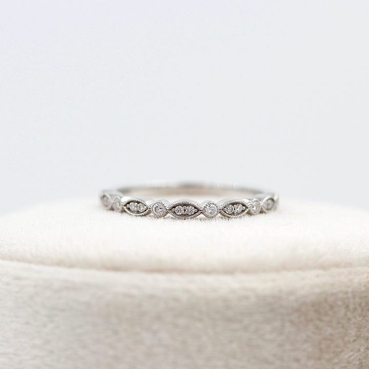 The Charlotte Wedding Band in White Gold atop a ring box