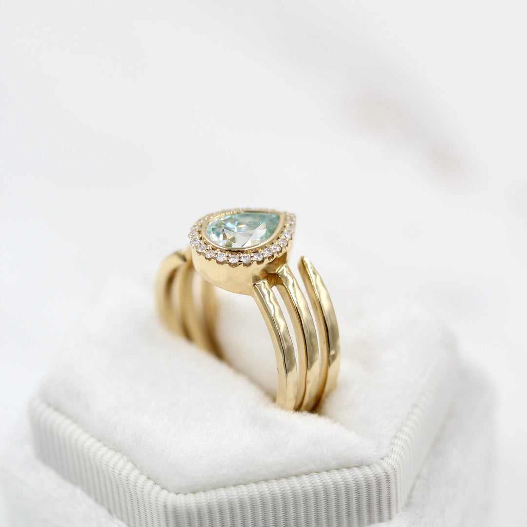 The Chelsea ring in yellow gold in a white velvet ring box