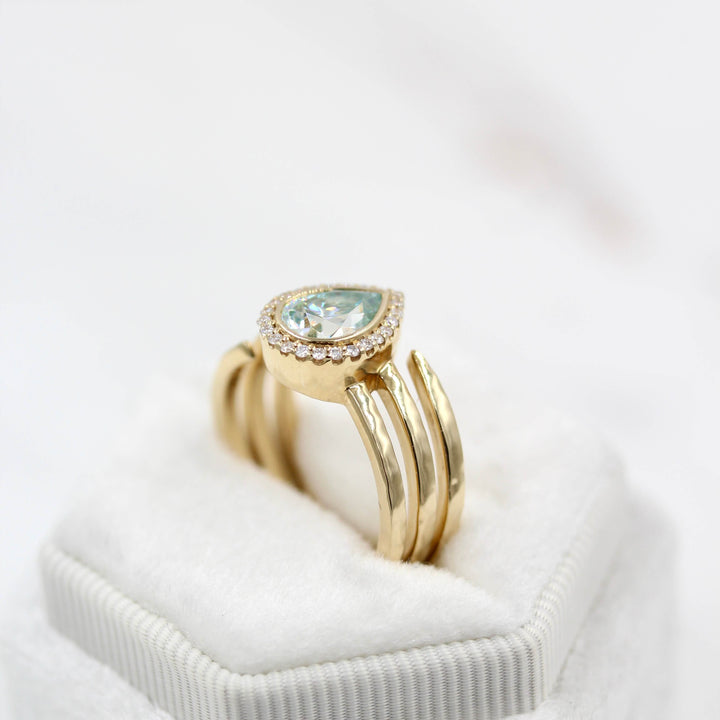 The Chelsea ring in yellow gold in a white velvet ring box