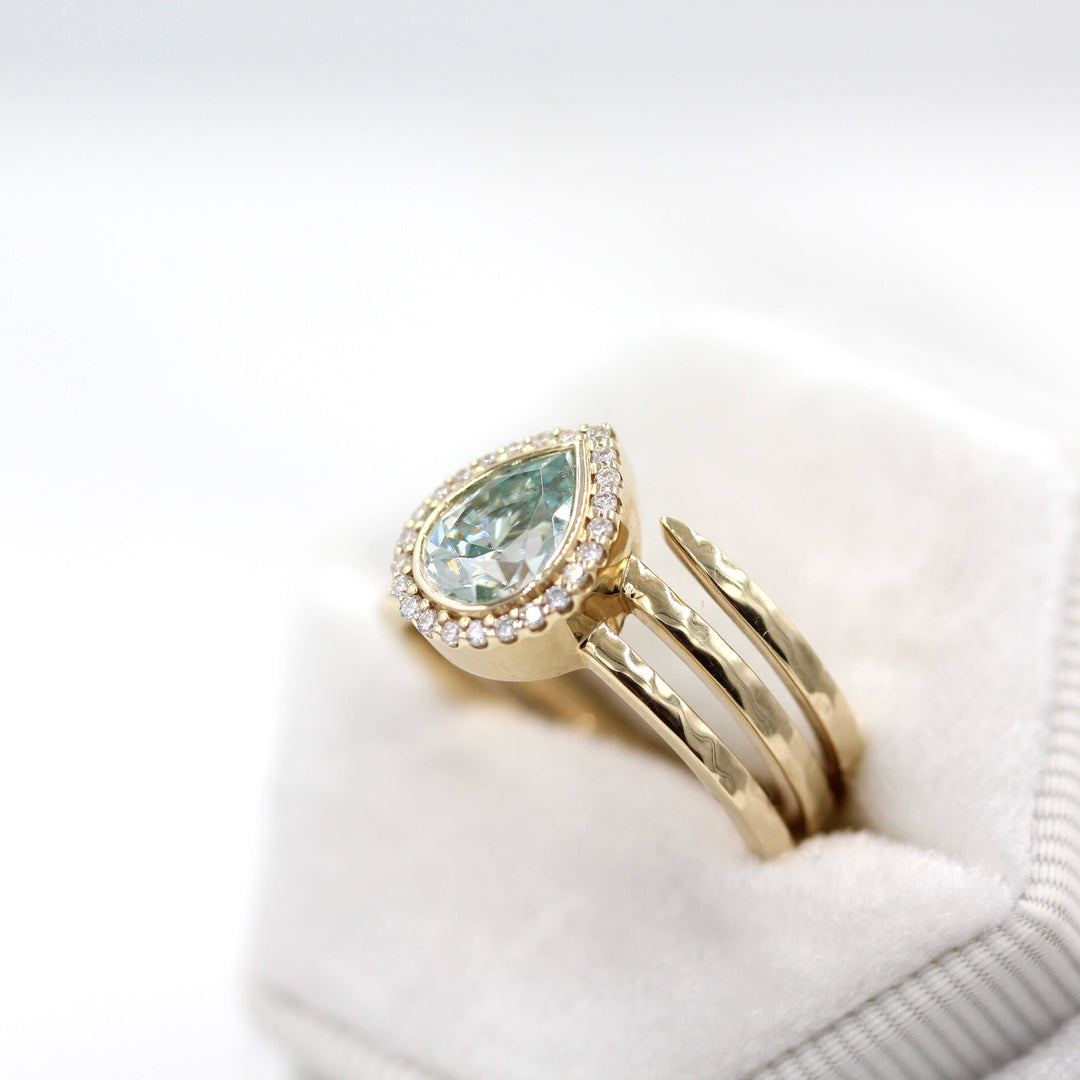 The Chelsea ring in yellow gold in a white velvet ring box