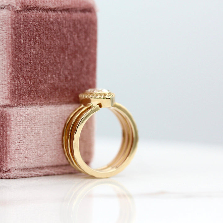 The Chelsea Ring in Yellow Gold with 1ct Lab-Grown Diamond leaning against a pink velvet ring box