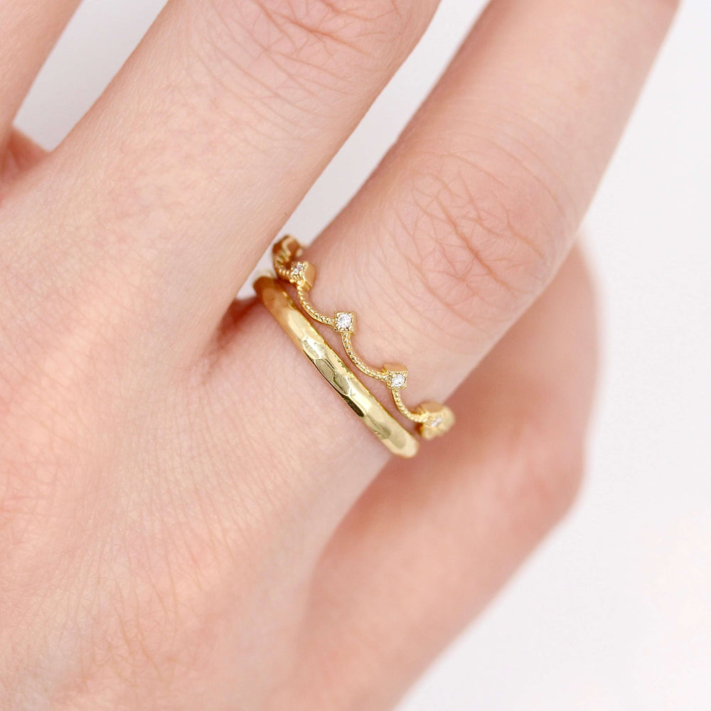 The Christie Bands in Yellow Gold modeled on a hand