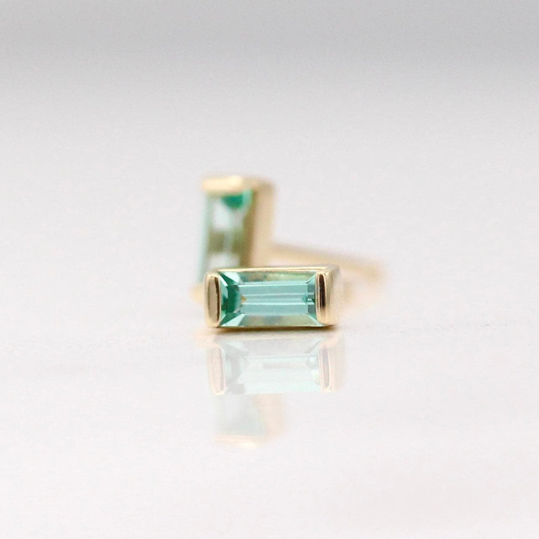 The August Baguette Birthstone Earrings with Chrysoberyl in Yellow Gold against a white background