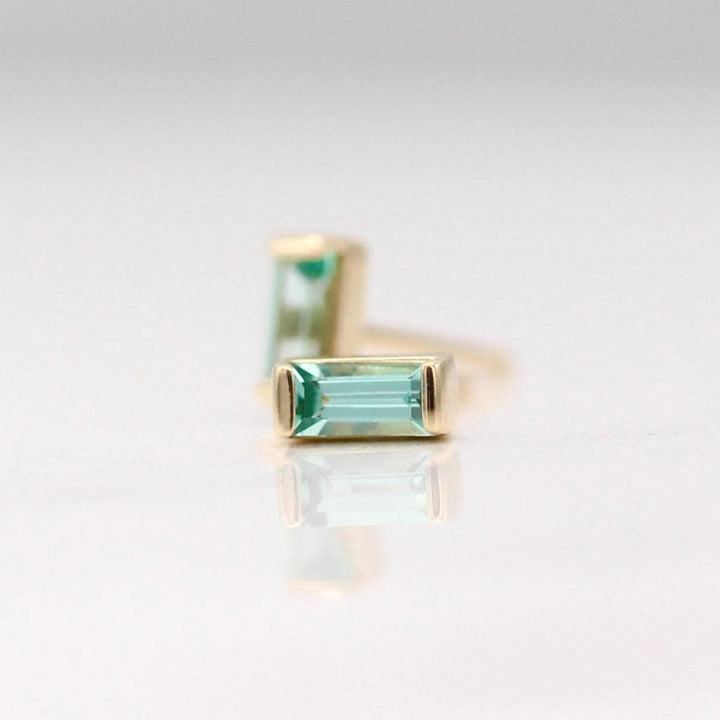 The August Baguette Birthstone Earrings with Chrysoberyl in Yellow Gold against a white background