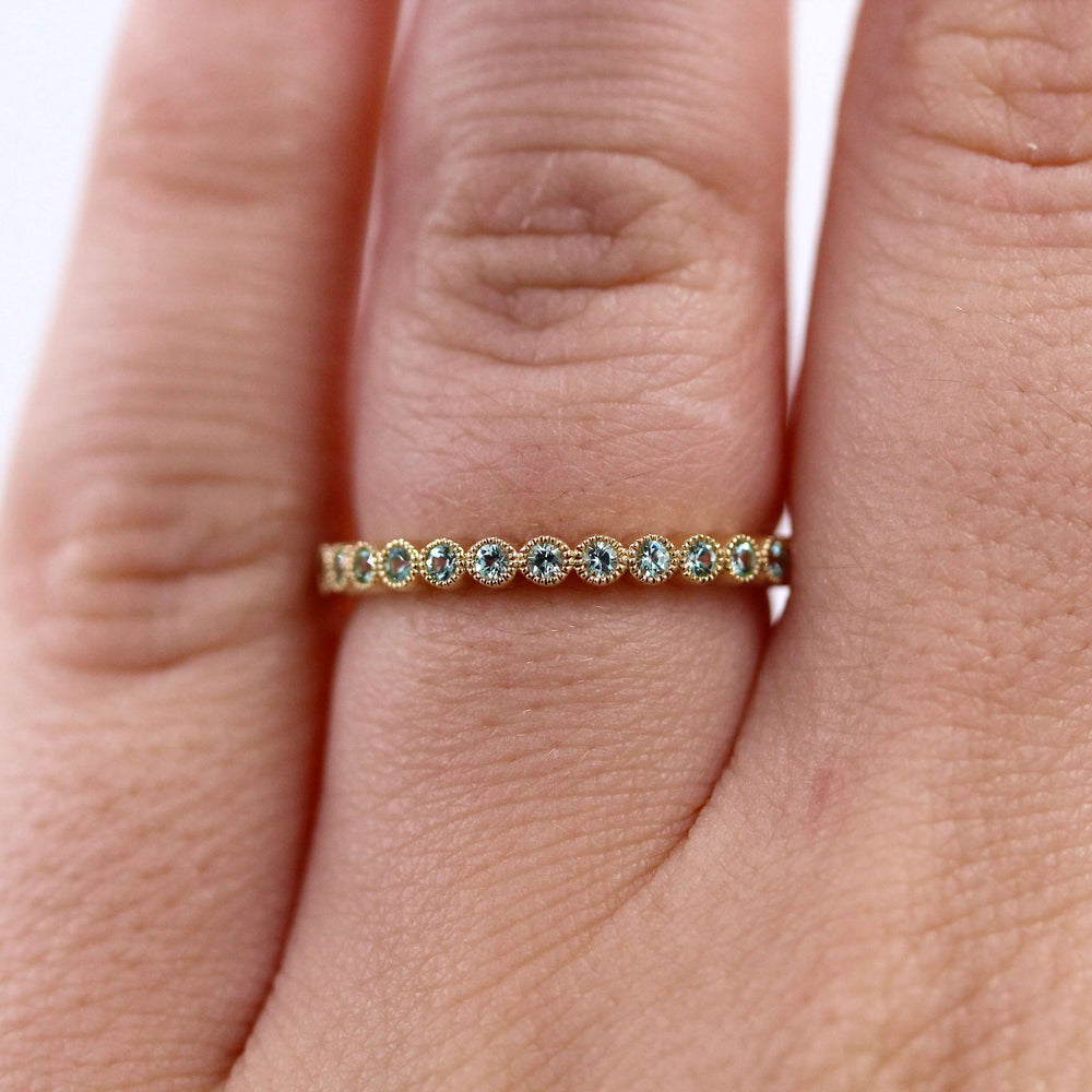 The August Florence Birthstone Wedding Band with Chrysoberyl in Yellow Gold modeled