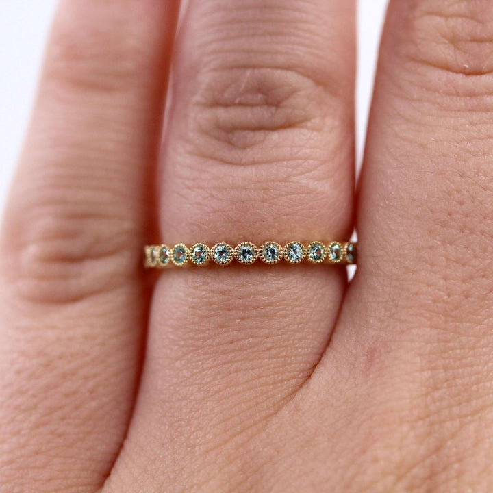 The August Florence Birthstone Wedding Band with Chrysoberyl in Yellow Gold modeled
