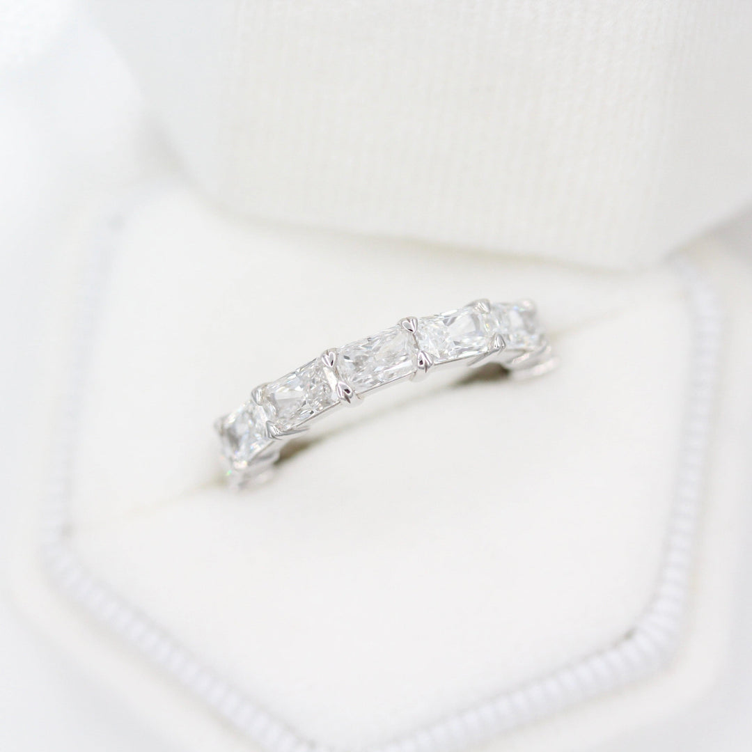 The Clara Wedding Band in White Gold in a white velvet ring box