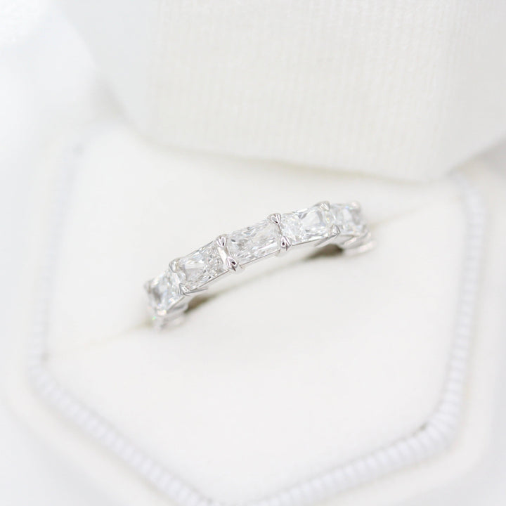 The Clara Wedding Band in White Gold in a white velvet ring box