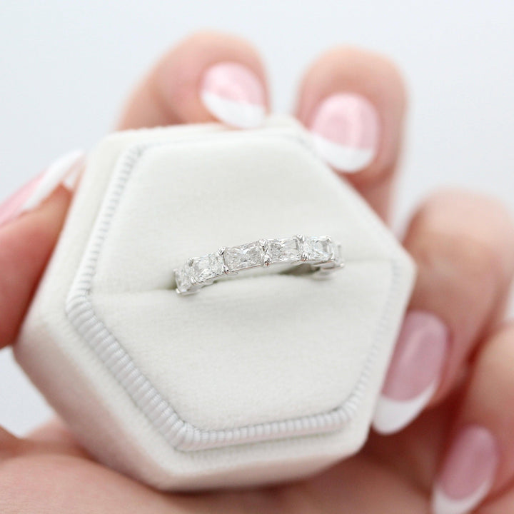 The Clara Wedding Band in White Gold in a white velvet ring box