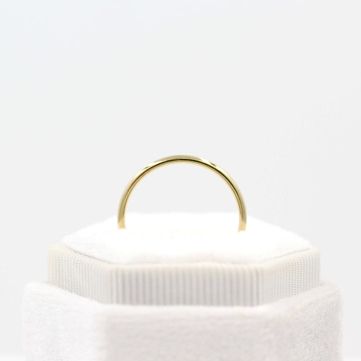 Classic Stacking Band in Yellow Gold in a white velvet ring box