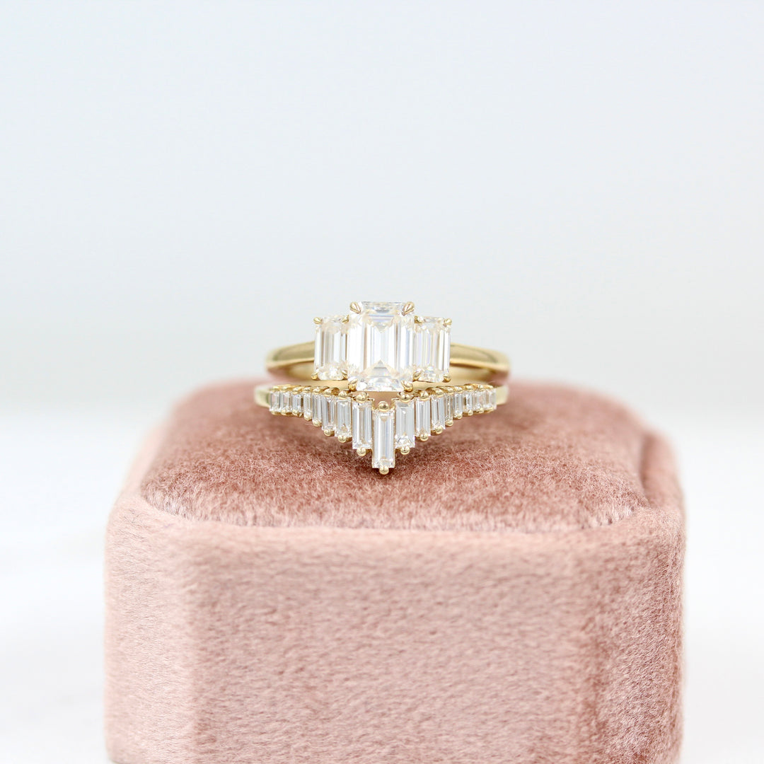 Darby Wedding Band in yellow gold paired with the Kendall ring in yellow gold on a pink velvet ring box