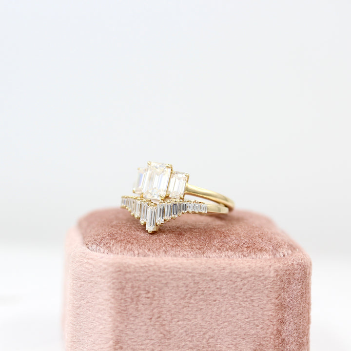 Darby Wedding Band in yellow gold paired with the Kendall ring in yellow gold on a pink velvet ring box