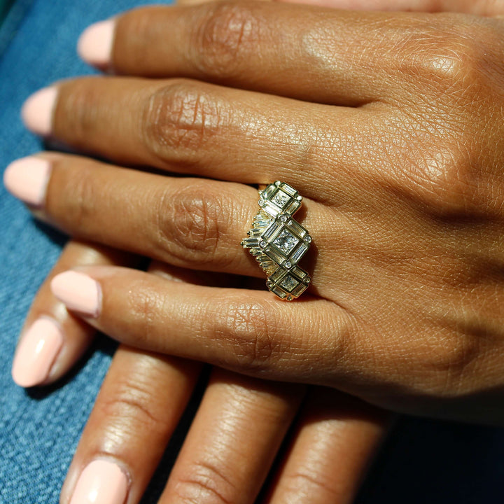 The Darby Ring in Yellow Gold stacked with the Darby wedding band in yellow gold modeled on hand