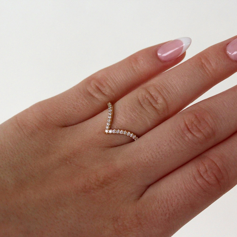 The Deep Diamond V Wedding Band in Yellow Gold modeled