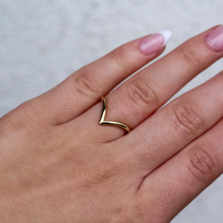 The Deep V Wedding Band in Yellow Gold modeled