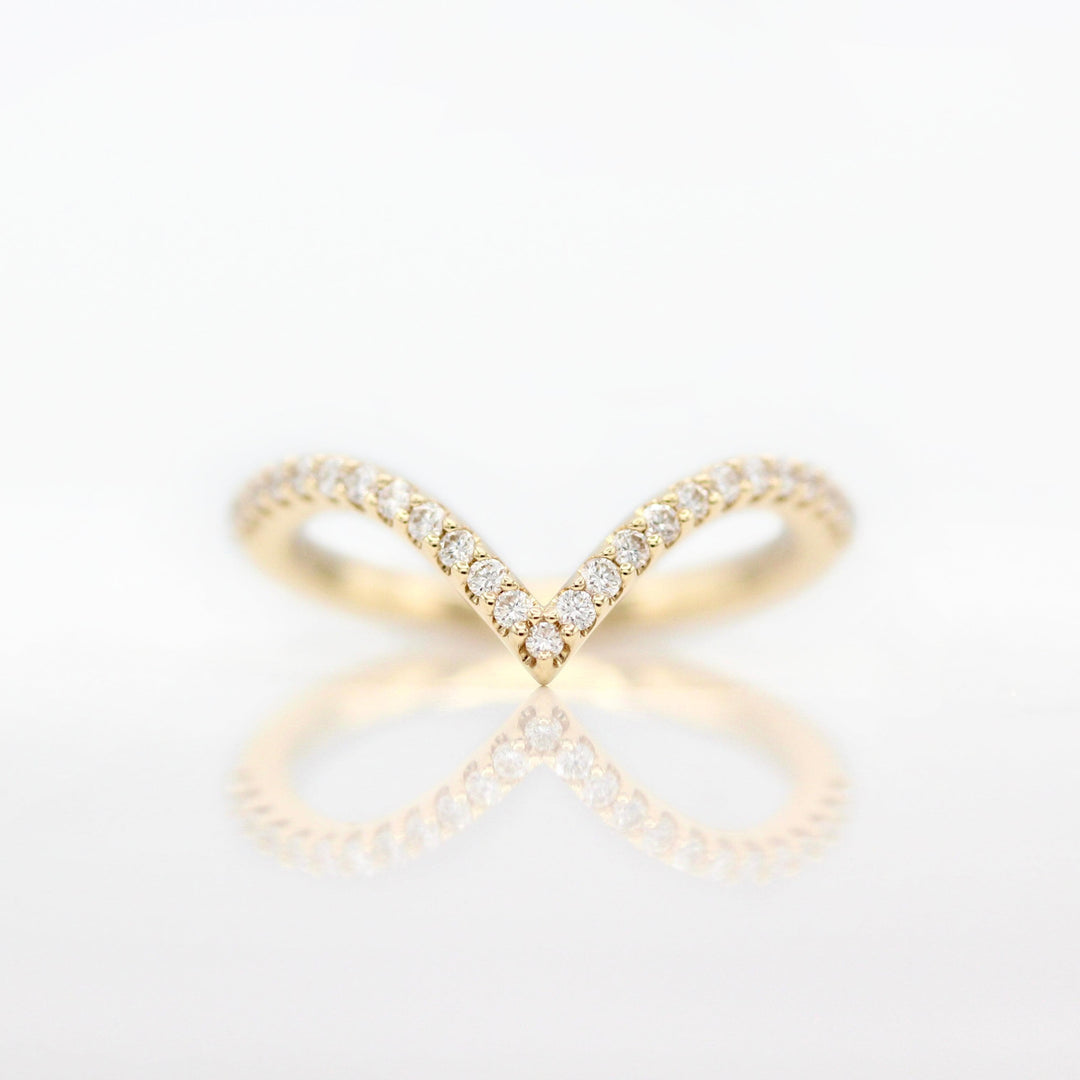 The Deep V Diamond Wedding Band in Yellow Gold against a white background