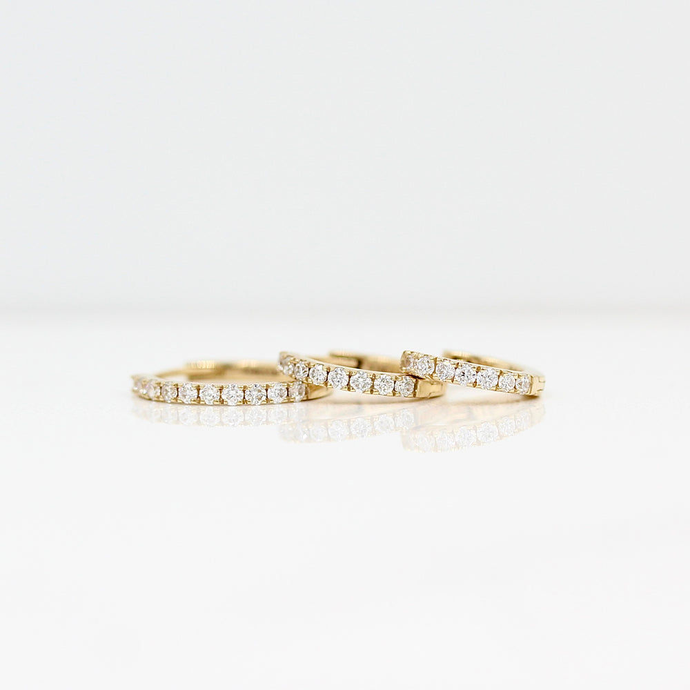 10mm, 12mm, or 14mm yellow gold diamond huggies against a white background
