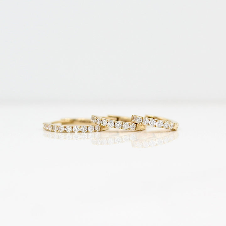 10mm, 12mm, or 14mm yellow gold diamond huggies against a white background