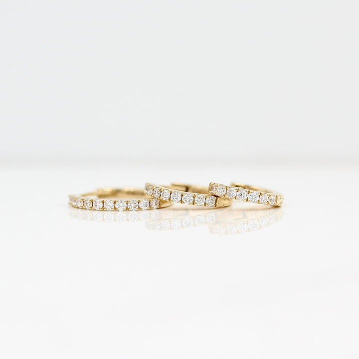 10mm, 12mm, and 14mm Diamond Huggies in Yellow Gold against a white background