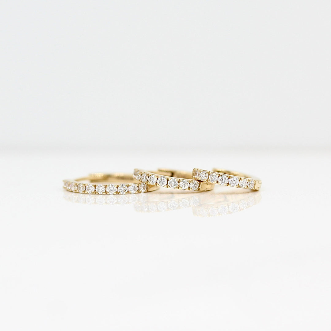 10mm, 12mm, and 14mm Diamond Huggies in Yellow Gold against a white background