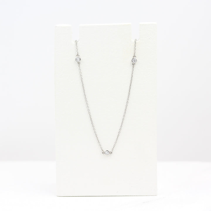 Diamond Station Necklace in White Gold on a white foam piece against a white background