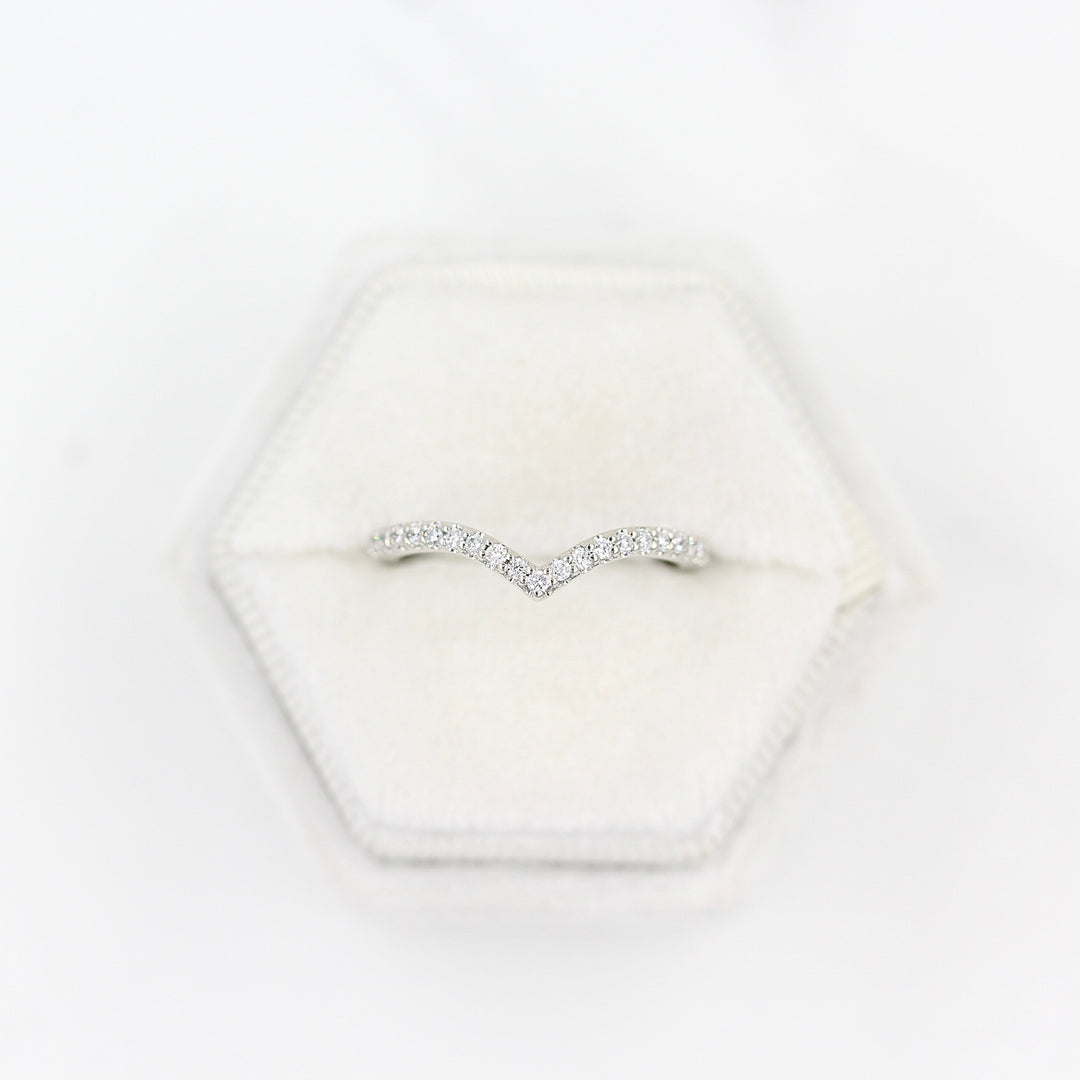 The Diamond V-Band in platinum inside a white velvet ring box