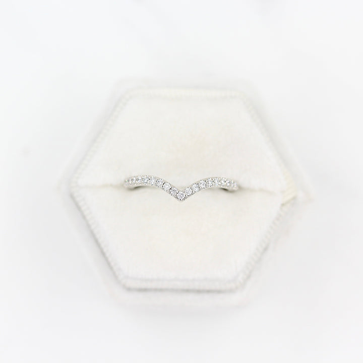 The Diamond V-Band in platinum inside a white velvet ring box