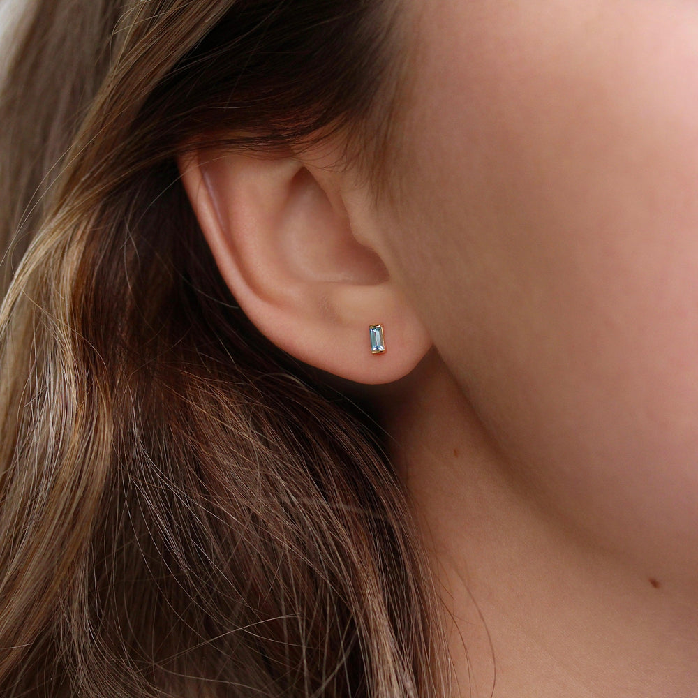 The April Baguette Birthstone Earrings with Lab-Grown Diamond in Yellow Gold modeled
