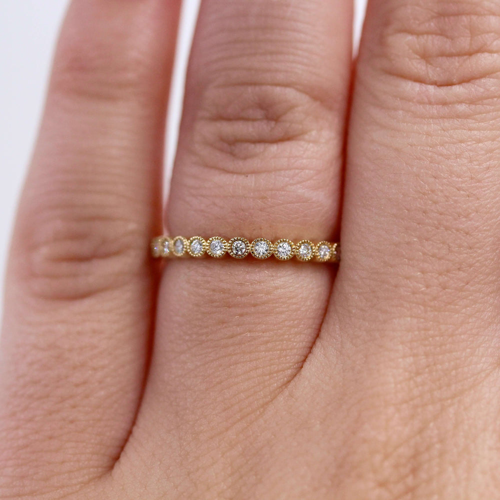 The April Florence Birthstone Wedding Band with Lab-Grown Diamond in Yellow Gold modeled