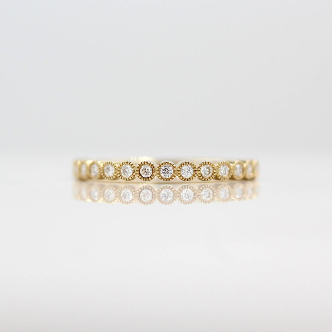 The April Florence Birthstone Wedding Band with Lab-Grown Diamond in Yellow Gold against a white background