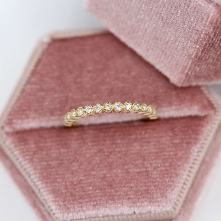 The April Florence Birthstone Wedding Band with Lab-Grown Diamond in Yellow Gold in a pink velvet ring box