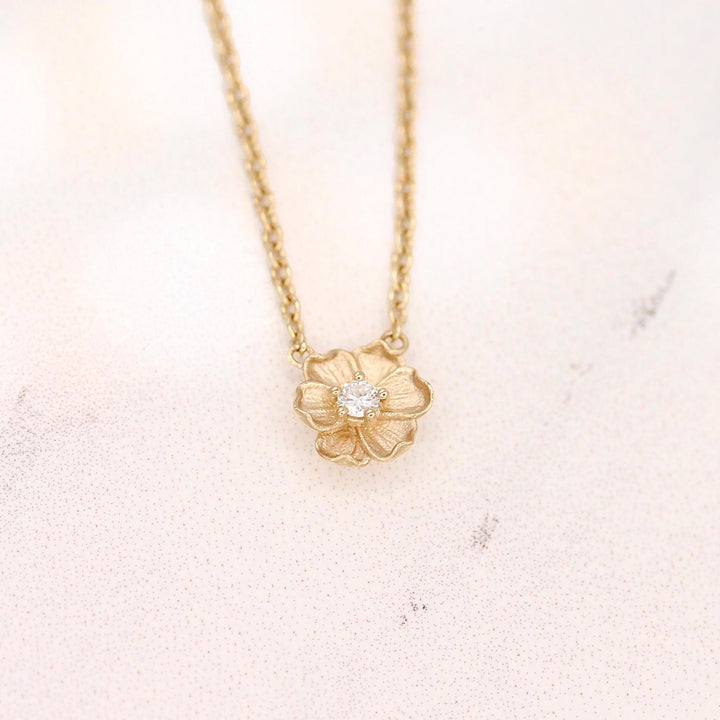The April Birthstone Poppy Necklace with Lab-Grown Diamond in Yellow Gold against a white background
