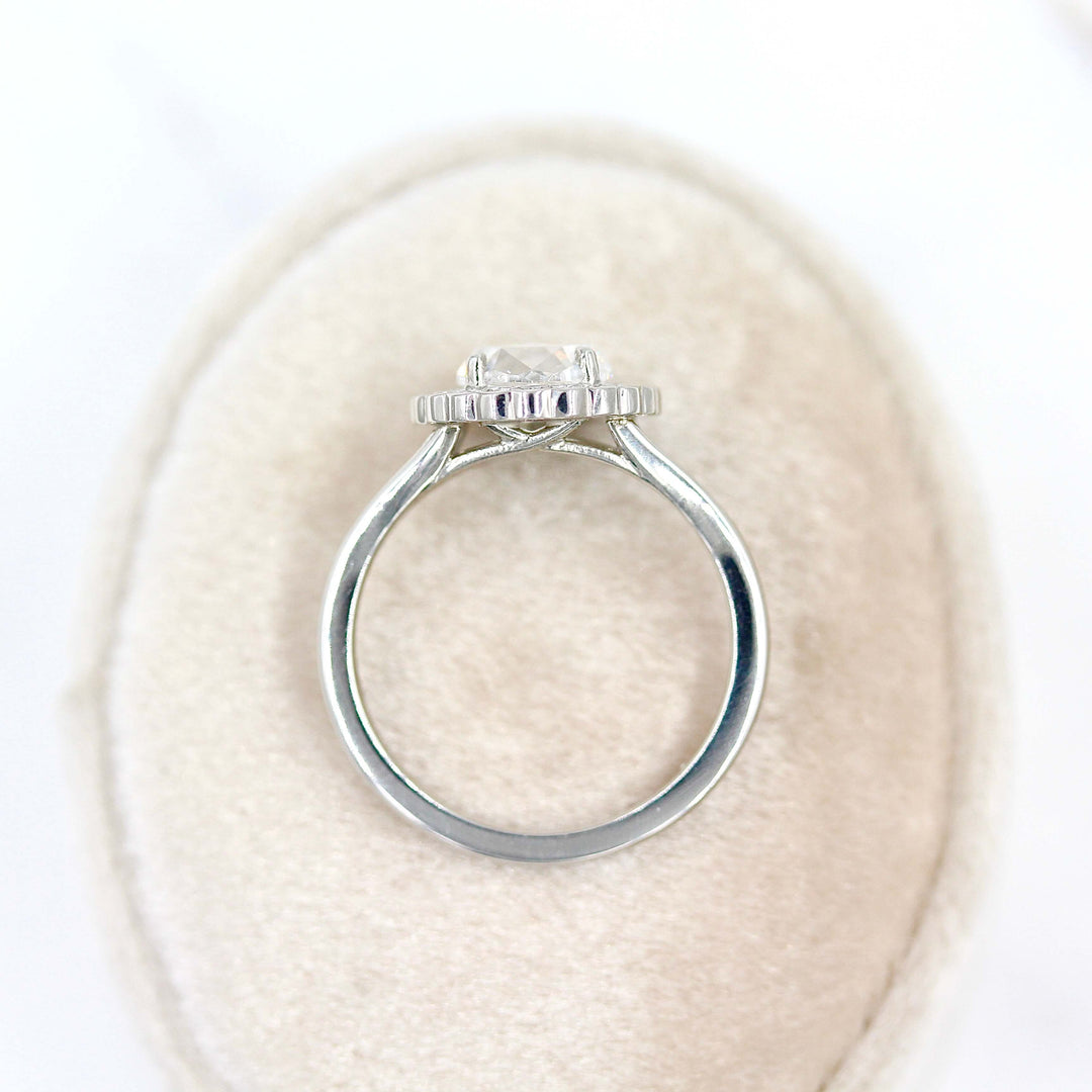 The Diana ring in white gold on a tan velvet ring box