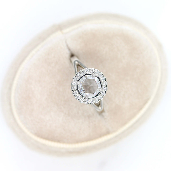 The Diana ring in white gold in a tan velvet ring box