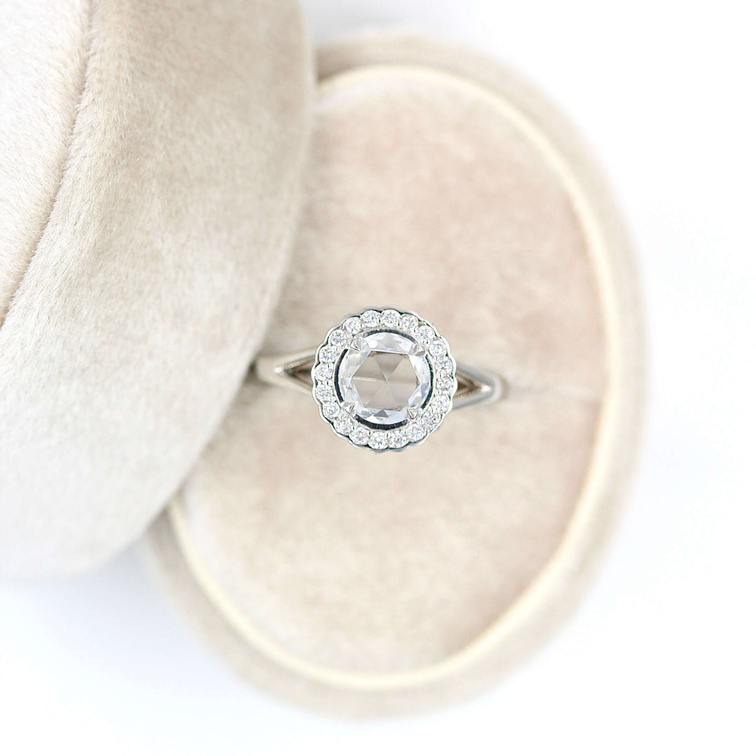 The Diana ring in white gold in a tan velvet ring box