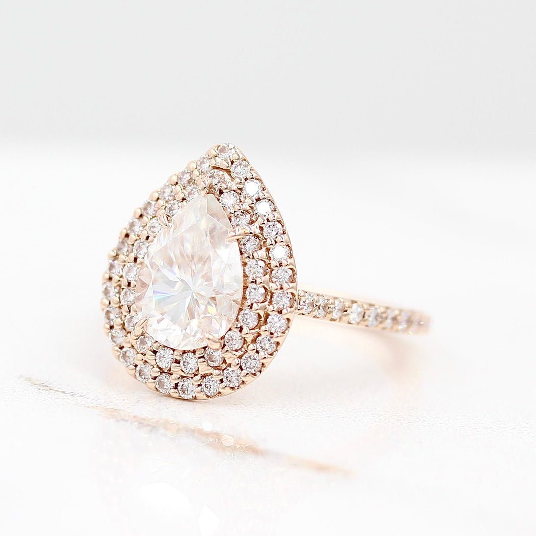 The Double-Halo Carly Ring in Rose Gold against a white background