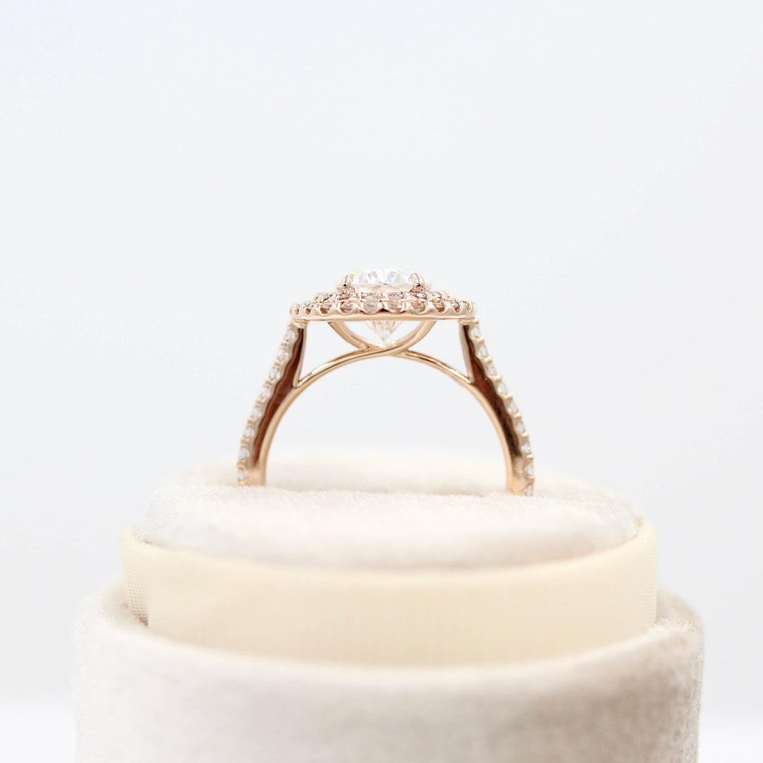 The Double-Halo Carly Ring in Rose Gold in a white velvet ring box