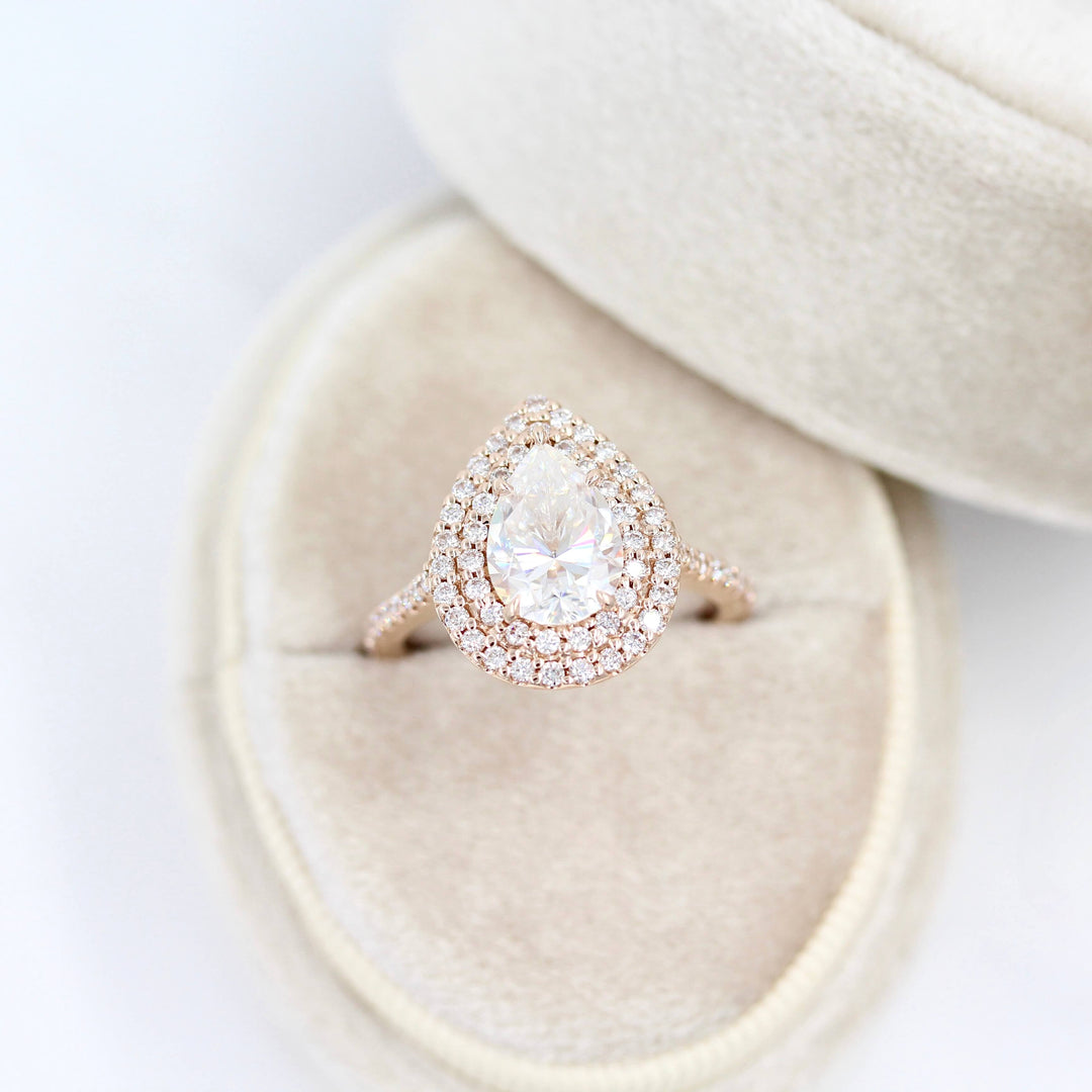 The Double-Halo Carly Ring in Rose Gold in a white velvet ring box