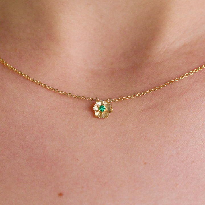 The May Birthstone Poppy Necklace with Emerald in Yellow Gold modeled