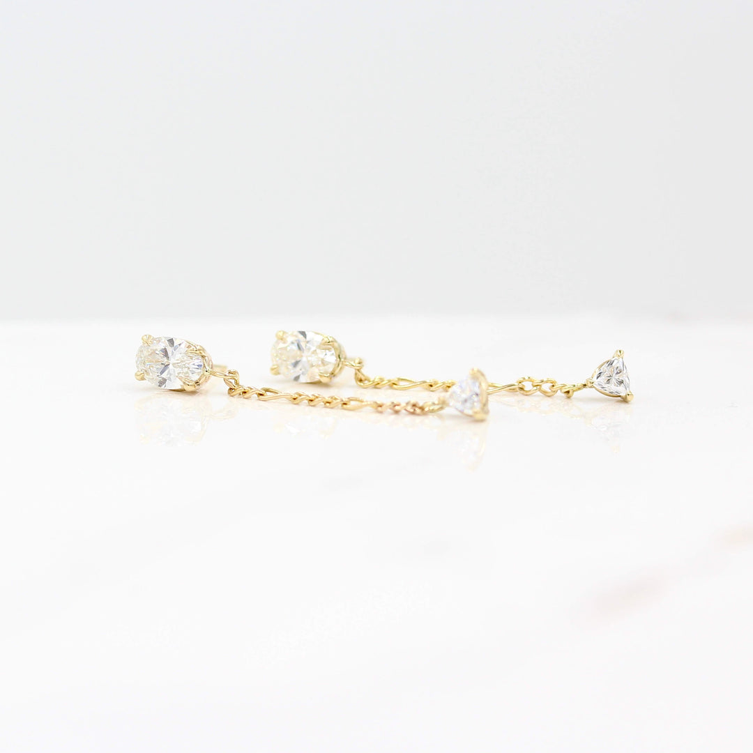 The Emilia Earrings in yellow gold against a white background
