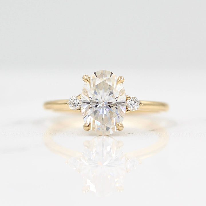 Esme oval ring in yellow gold against a white background