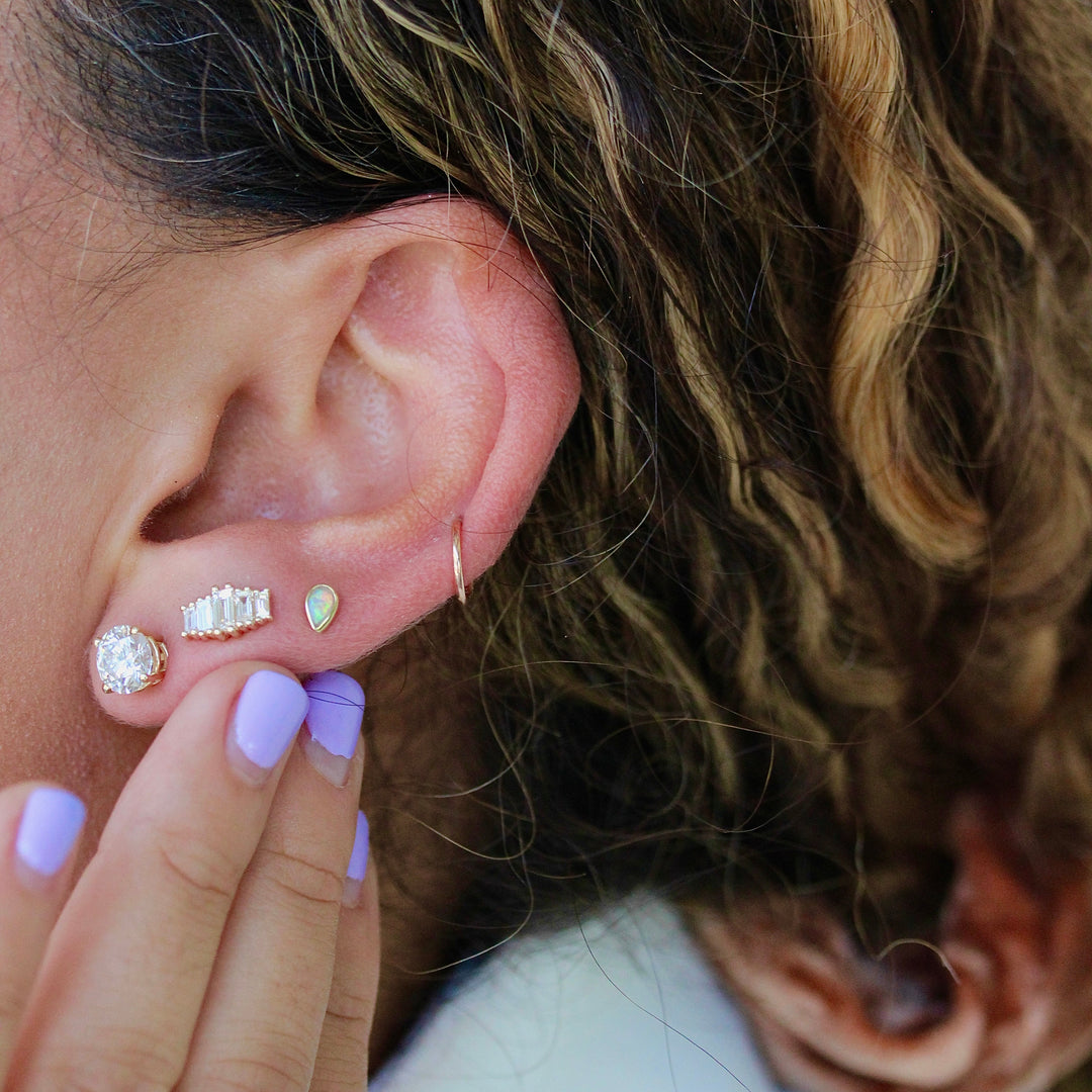 Model wearing lab grown diamond baguette earring