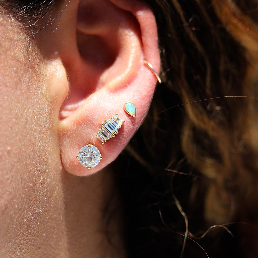 Model wearing lab grown diamond baguette earring