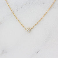 The Felicity Necklace in yellow gold against a white background