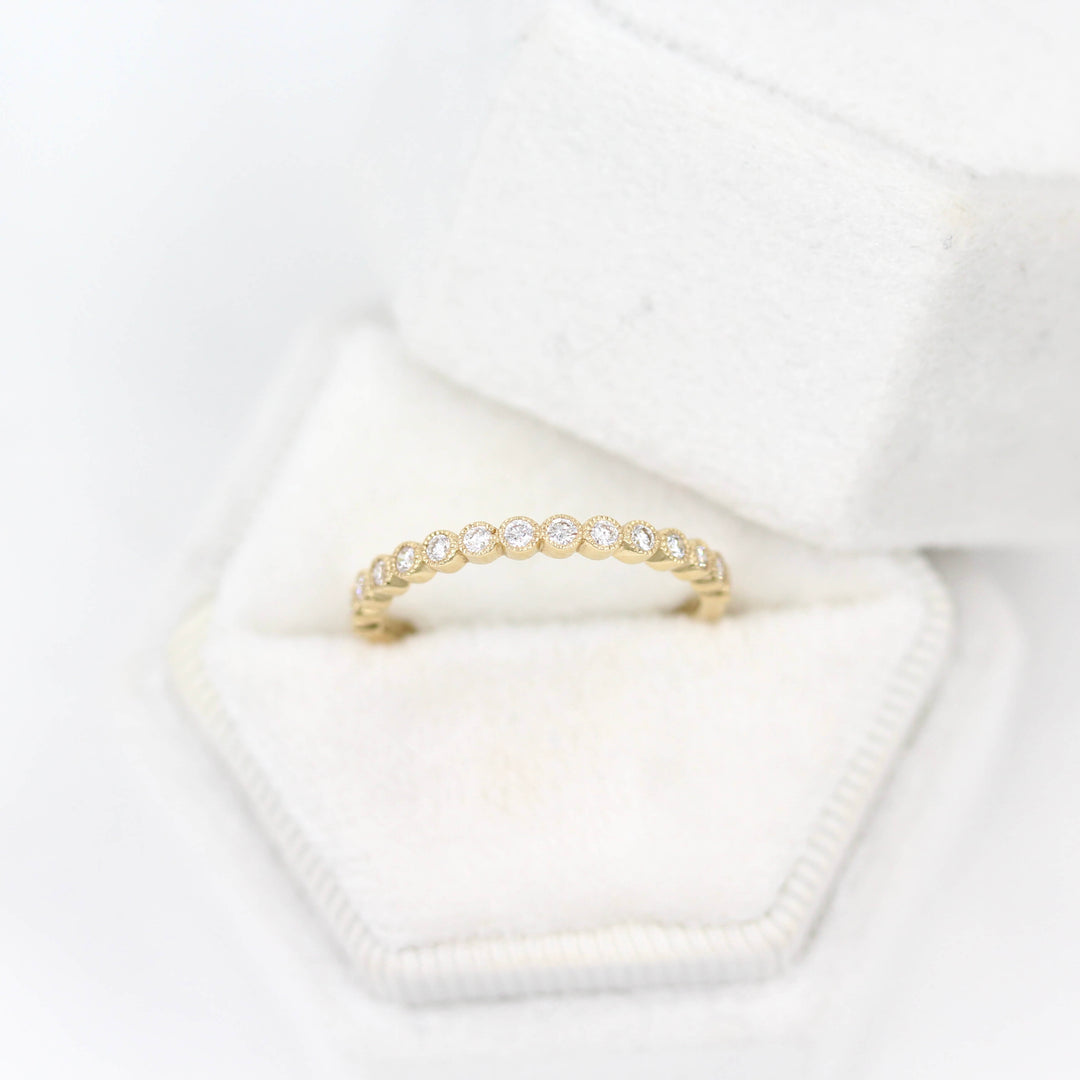 The Florence Wedding Band in Yellow Gold in a ring box