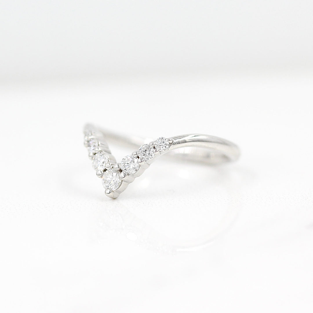 The Graduated Diamond V-Band in white gold against a white background