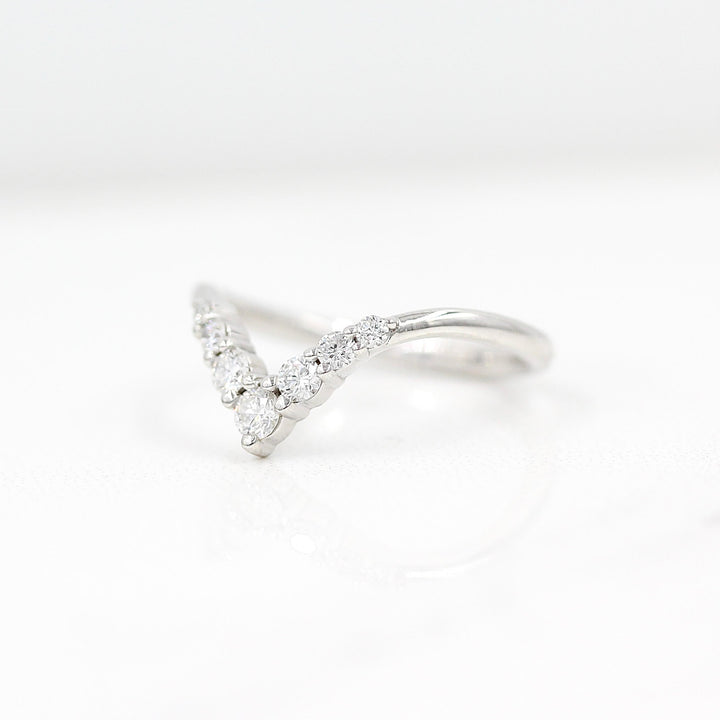 The Graduated Diamond V-Band in white gold against a white background